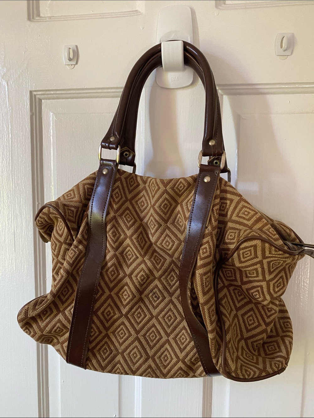 Small brown carry duffle from 40 plus years ago. Triangle pattern in beige/br